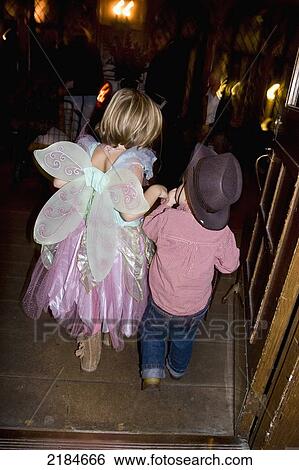 Usa, New York State, Rear View Of Two Children Trick Or Treating; New York City View Large Photo Image Stock Photograph - Usa, New York State, Rear View Of Two Children Trick Or Treating; New York City. Fotosearch