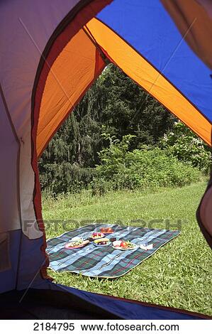 Stock Photography - Usa, New York State, Tent And Picnic On Grass At Camping Site; Hudson Valley. Fotosearch