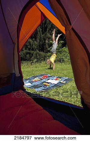 Usa, New York State, Woman Cartwheeling By Tent At Camping Site; Hudson Valley View Large Photo Image Stock Photo - Usa, New York State, Woman Cartwheeling By Tent At Camping Site; Hudson Valley. Fotosearch