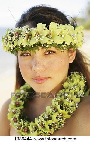 Picture - USA, Portrait of local girl with Haku And Neck Lei; Hawaii Islands. Fotosearch