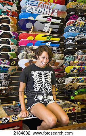 Usa, Rhode Island, Young Woman In Skateboard Shop; Newport View Large Photo Image Stock Image - Usa, Rhode Island, Young Woman In Skateboard Shop; Newport. Fotosearch