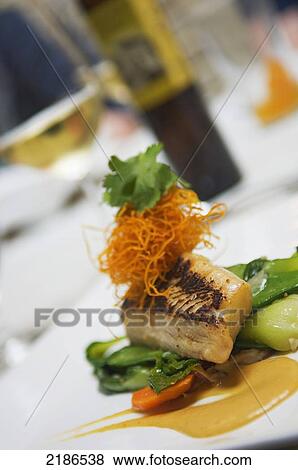 Stock Photo - USA, Sake glazed Alaskan Black Cod with ginger soy emulsion in Lunch at Restaurant Nora; Washington DC. Fotosearch