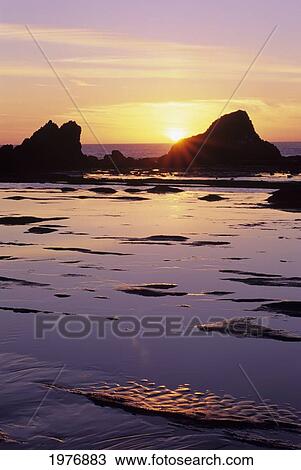 USA, Sun Setting Over Rocks And Beautiful Reflections; Oregon, Seal Rock View Large Photo Image Stock Image - USA, Sun Setting Over Rocks And Beautiful Reflections; Oregon, Seal Rock. Fotosearch