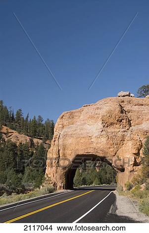 Picture - USA, Utah, Dixie National Forest, Red Canyon, Claron Limestone Formations, Tunnel cut through rock formation for road.. Fotosearch