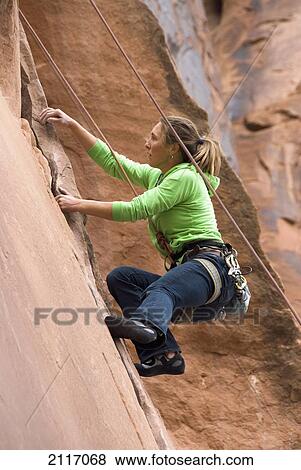 USA, Utah, near Moab, off Utah Scenic Byway 279, young woman rock climbing View Large Photo Image Stock Photo - USA, Utah, near Moab, off Utah Scenic Byway 279, young woman rock climbing. Fotosearch