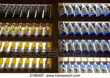Stock Photo - USA, Virginia, Rows of colorful wine bottles at Jefferson Vineyards; Charlottesville. Fotosearch
