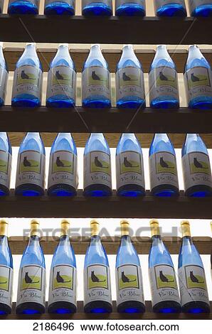 Stock Photograph - USA, Virginia, Rows of colorful wine bottles at Jefferson Vineyards; Charlottesville. Fotosearch