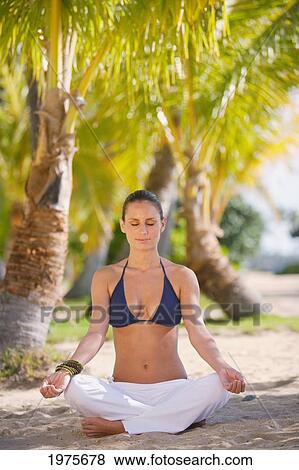 USA, Woman Meditating On Beach Among Palm Trees; Hawaii Islands View Large Photo Image Stock Photo - USA, Woman Meditating On Beach Among Palm Trees; Hawaii Islands. Fotosearch