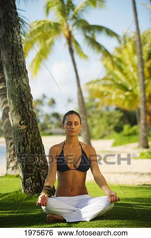 USA, Woman Meditating On Grass Near Beach; Hawaii Islands View Large Photo Image Stock Photograph - USA, Woman Meditating On Grass Near Beach; Hawaii Islands. Fotosearch