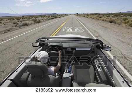 Usa, Young Woman Driving Her Convertible Car Through Desert Along Route 66; California View Large Photo Image Stock Image - Usa, Young Woman Driving Her Convertible Car Through Desert Along Route 66; California. Fotosearch