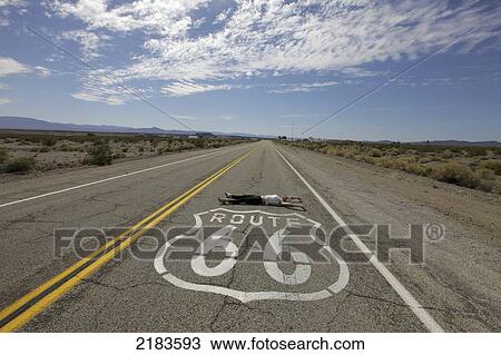 Usa, Young Woman Lying In Deserted Road On Route 66; California View Large Photo Image Stock Image - Usa, Young Woman Lying In Deserted Road On Route 66; California. Fotosearch