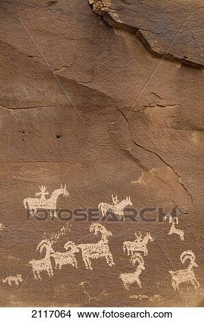 Utah, Arches National Park, Ancient Petroglyphs depicting animals on rock. View Large Photo Image Picture - Utah, Arches National Park, Ancient Petroglyphs depicting animals on rock.. Fotosearch