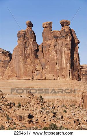 Stock Photo - Utah, Arches National Park, Courthouse Towers, Closeup Of The Three Gossips Landmark.. Fotosearch