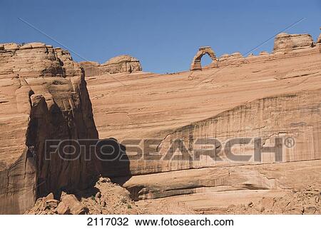 Stock Image - Utah, Arches National Park, Rock formation and Delicate Arch.. Fotosearch