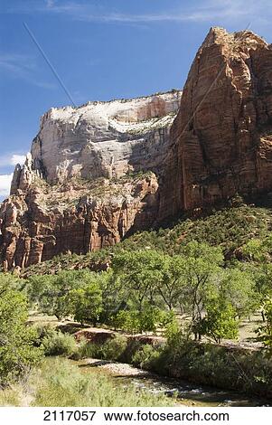 Stock Photo - Utah, Zion National Park, Virgin River and lush foliage near Zion Lodge.. Fotosearch