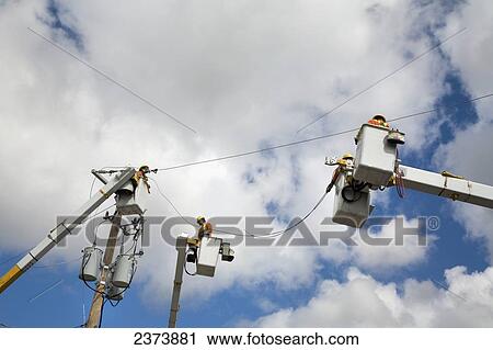 Utility Workers In Cranes; Saskatchewan, Canada View Large Photo Image Stock Image - Utility Workers In Cranes; Saskatchewan, Canada. Fotosearch