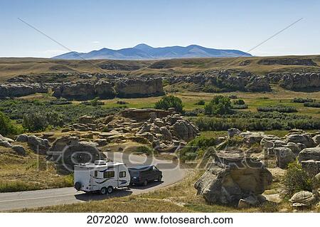 Van With A Trailer On A Road Through Writing On Stone Provincial Park, Alberta View Large Photo Image Stock Image - Van With A Trailer On A Road Through Writing On Stone Provincial Park, Alberta. Fotosearch