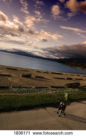 Vancouver, British Columbia, Canada; People Walking Along Beach Waterfront View Large Photo Image Stock Image - Vancouver, British Columbia, Canada; People Walking Along Beach Waterfront. Fotosearch