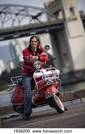 Stock Image - Vancouver, British Columbia, Canada; Motorcyclist. Fotosearch