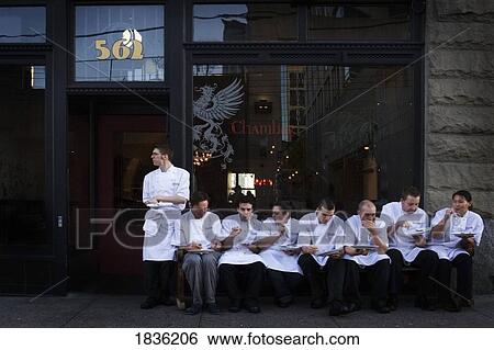 Stock Photograph - Vancouver, British Columbia, Canada; Group Of Male Chefs On A Break. Fotosearch