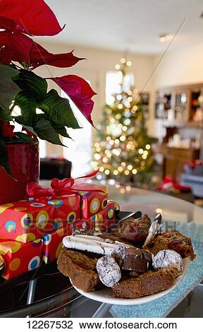 Variety of sweets in a bowl beside the gifts and poinsettia plant at Christmas time; Chilliwack, British Columbia, Canada View Large Photo Image Stock Image - Variety of sweets in a bowl beside the gifts and poinsettia plant at Christmas time; Chilliwack, British Columbia, Canada. Fotosearch