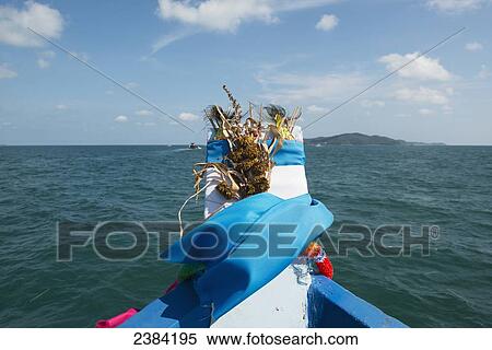 Various plant and seaweed decorate the front of a boat on the ocean; Koh Samet Island, Thailand View Large Photo Image Stock Photography - Various plant and seaweed decorate the front of a boat on the ocean; Koh Samet Island, Thailand. Fotosearch