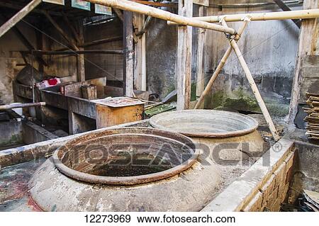 Stock Photo - Vats used to dye batik fabrics at Gunawan Setiawan Batik Shop, Kampung Kauman, Surakarta (Solo), Central Java, Indonesia. Fotosearch