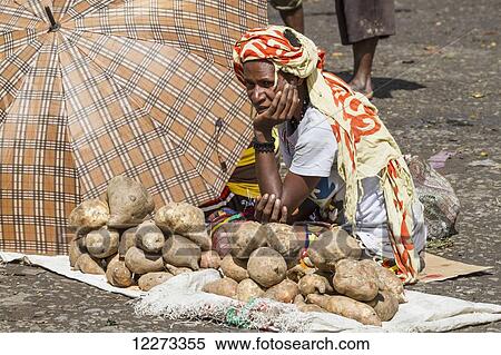 Stock Photography - Vegetable vendor at the market, Wamena, Papua, Indonesia. Fotosearch