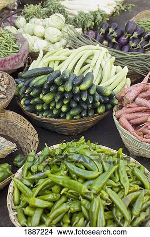 Picture - Vegetables In Baskets In A Market, High Angle View. Fotosearch