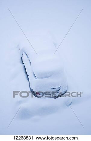 Stock Image - Vehicle covered in fresh, deep snow, Mt. Cook, New Zealand. Fotosearch