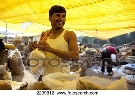 Vendor bags produce, Chaudi Market, Chaudi, Goa, India. View Large Photo Image Stock Image - Vendor bags produce, Chaudi Market, Chaudi, Goa, India.. Fotosearch