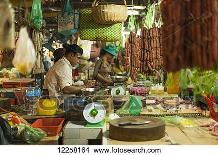 Picture - Vendors and shoppers in the old market; Siem Reap, Cambodia. Fotosearch