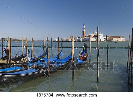 Venice, Italy; Gondolas In The Water With The Church Of San Giorgio Maggiore In The Distance View Large Photo Image Picture - Venice, Italy; Gondolas In The Water With The Church Of San Giorgio Maggiore In The Distance. Fotosearch