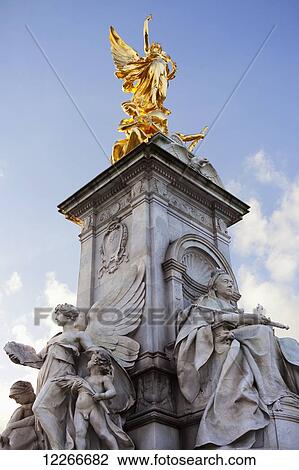 Stock Image - Victoria Memorial Statue at Buckingham Palace; London, England. Fotosearch
