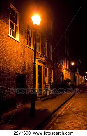 Victorian street lamp lights streets of East London at night; London, England View Large Photo Image Stock Image - Victorian street lamp lights streets of East London at night; London, England. Fotosearch