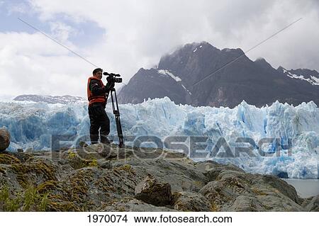 Videographer In Front Of The San Rafael Glacier, Laguna San Rafael National Park, Aysen Region, Chile View Large Photo Image Picture - Videographer In Front Of The San Rafael Glacier, Laguna San Rafael National Park, Aysen Region, Chile. Fotosearch