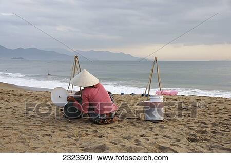 Vietnam, Beach Vendor In Early Morning; Nha Trang View Large Photo Image Stock Photo - Vietnam, Beach Vendor In Early Morning; Nha Trang. Fotosearch