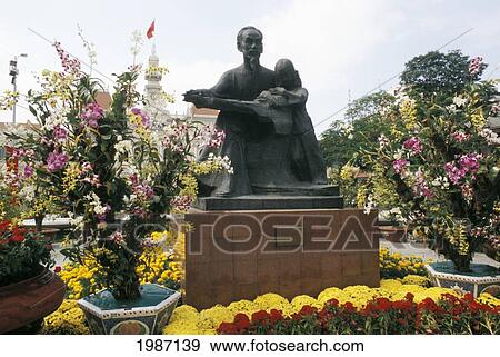Vietnam, Ho Chi Minh City (Saigon), Uncle Ho Statue In City Center, Surrounded By Flowers. View Large Photo Image Stock Photo - Vietnam, Ho Chi Minh City (Saigon), Uncle Ho Statue In City Center, Surrounded By Flowers.. Fotosearch