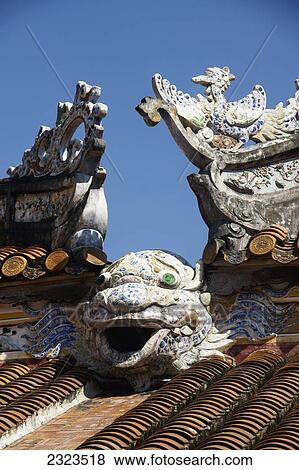 Stock Photo - Vietnam, Hue, Carved water feature on roof; Imperial Citadel. Fotosearch