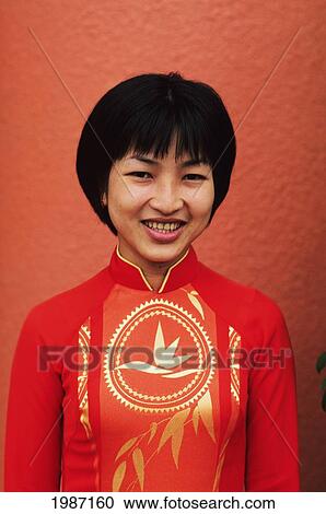Vietnam, Portrait of local woman wearing red dress; Ho Chi Minh City (Saigon) View Large Photo Image Stock Image - Vietnam, Portrait of local woman wearing red dress; Ho Chi Minh City (Saigon). Fotosearch