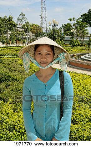 Vietnam, Saigon, Ho Chi Minh, Portrait Of A Young Vietnamese Woman In Traditional Clothing. View Large Photo Image Stock Image - Vietnam, Saigon, Ho Chi Minh, Portrait Of A Young Vietnamese Woman In Traditional Clothing.. Fotosearch