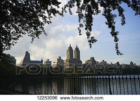View across Central Park Reservoir looking towards Upper West Side of Manhattan; New York City, New York, United States of America View Large Photo Image Stock Photograph - View across Central Park Reservoir looking towards Upper West Side of Manhattan; New York City, New York, United States of America. Fotosearch