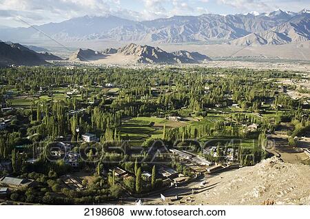 View across the Indus Valley from the Shanti (Peace) Stupa in Changspa. Leh was the capital of the Himalayan kingdom of Ladakh, now the Leh District in the state of Jammu and Kashmir, India. Leh is at an altitude of 3, 500 meters (11, 483 ft). View Large Photo Image Stock Photo - View across the Indus Valley from the Shanti (Peace) Stupa in Changspa. Leh was the capital of the Himalayan kingdom of Ladakh, now the Leh District in the state of Jammu and Kashmir, India. Leh is at an altitude of 3, 500 meters (11, 483 ft).. Fotosearch