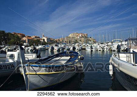 Stock Image - View across the marina and citadel to Calvi. The Balagne district. Corsica. France. Fotosearch