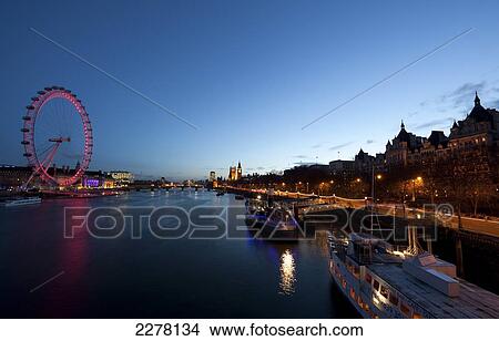 View across the Thames towards The London Eye and Houses of Parliament, Westminster; London, England View Large Photo Image Picture - View across the Thames towards The London Eye and Houses of Parliament, Westminster; London, England. Fotosearch