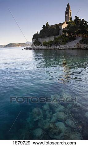 Stock Photo - View Across Water At A Monastery On The Island Of Lopud.. Fotosearch
