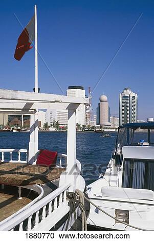 View Across Water To Dubai, With Boats In The Foreground. View Large Photo Image Stock Image - View Across Water To Dubai, With Boats In The Foreground.. Fotosearch
