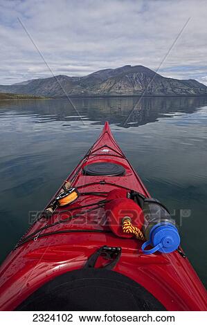 View down the bow of a kayak on Kusawa Lake; Yukon, Canada View Large Photo Image Stock Image - View down the bow of a kayak on Kusawa Lake; Yukon, Canada. Fotosearch