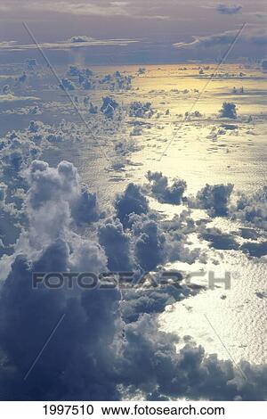 View From Above Clouds Over Ocean, Sun Reflections A35G View Large Photo Image Stock Image - View From Above Clouds Over Ocean, Sun Reflections A35G. Fotosearch