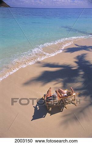 View From Above Senior Couple In Lounge Chairs Along Shore Line, Palm Shadow View Large Photo Image Stock Image - View From Above Senior Couple In Lounge Chairs Along Shore Line, Palm Shadow. Fotosearch